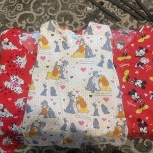 Lot of 3 Disney scrub tops size xs.